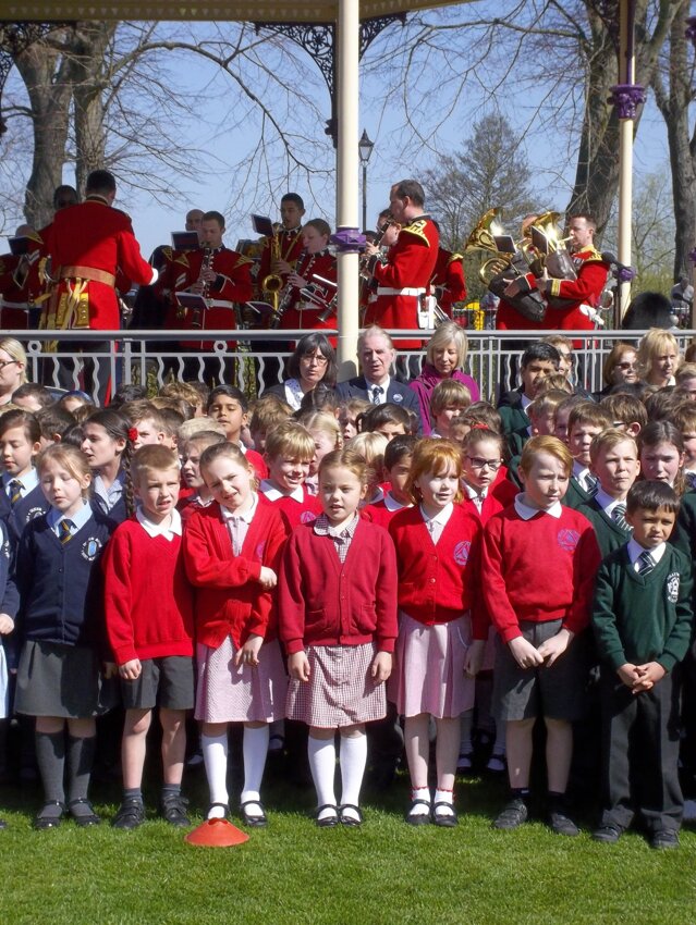 Image of Year 3 sing in front of Her Majesty the Queen for the opening of the bandstand and the celebration of her 90th birthday